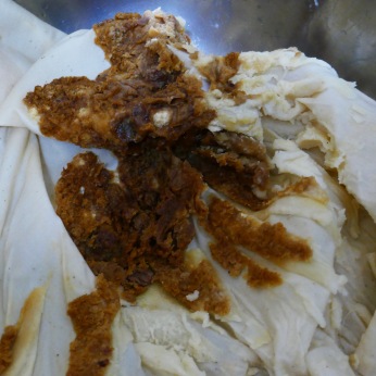 peel cake from calico cloth after reboiling.